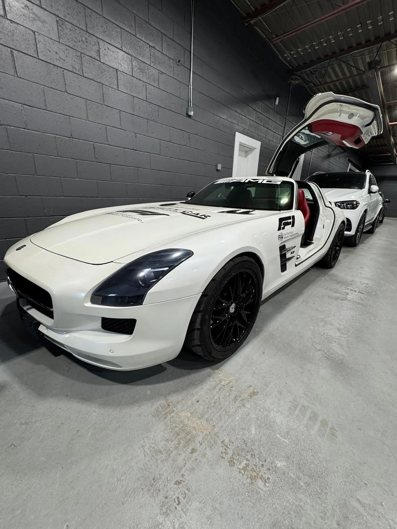 Certified, Clean Carfax, garage kept, local vehicle, non-smoker 2011 Mercedes-Benz SL-Class SL63AMG in White with Red interior – front exterior view Certified, Clean Carfax, garage kept, local vehicle, non-smoker 2011 Mercedes-Benz SL-Class SL63AMG in White with Red interior – front exterior view